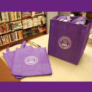 FOL purple books bags filled and empty on table